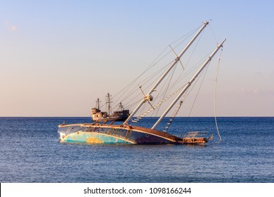 Yacht Shipwreck And Sailboat, Sunset Colors. Sinking Ship.