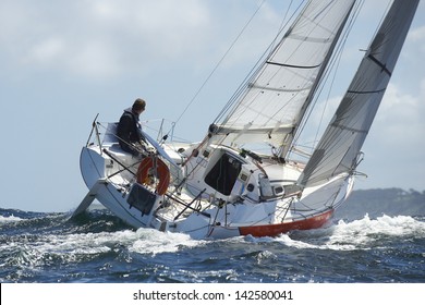 Yacht And Skipper Sailing At Competition