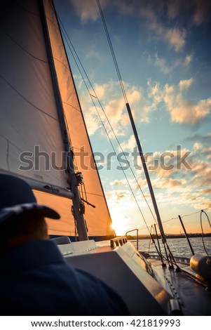 yacht at sunset and diffuse back man