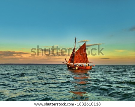Yacht with tourists sailing  in Vistula Lagoon at sunset. Zdjęcia stock © 