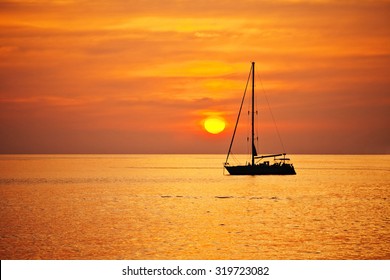 Yacht in the tropical sea at sunset 