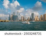 Yacht view of Dubai Marina, where the glittering skyline of downtown Dubai unfolds in all its splendor. Luxurious and unforgettable experience with iconic landmarks from the comfort of a yacht