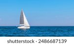 Yacht, white sailboat under head genoa and main sails sailing in an calm open sea. Cruise, vacations, regatta, sport. Gulf of Finland
