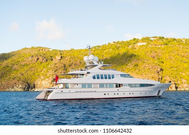 Yachting And Sailing Adventure In Gustavia, St.barts. Yacht At Sea Coast On Sunny Blue Sky. Luxury Travel And Voyage On Boat. Summer Vacation On Tropical Island. Water Transport And Marine Vessel.