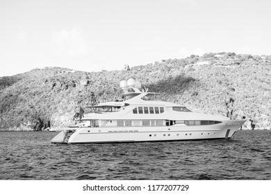 Yachting And Sailing Adventure In Gustavia, St.barts. Yacht At Sea Coast On Sunny Blue Sky. Luxury Travel And Voyage On Boat. Summer Vacation On Tropical Island. Water Transport And Marine Vessel.