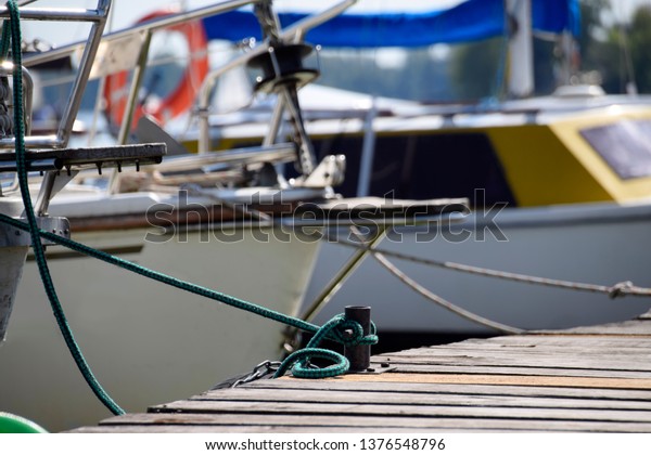 yachting - sailing\
boats at a landing\
stage