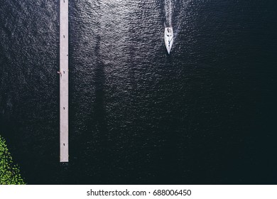 Yachts From Above On A Dark Water Background.