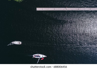 Yachts From Above On A Dark Water Background.