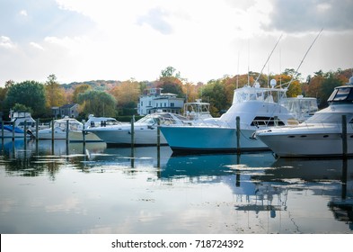 Yachts In Harbour On A Cloudy Autumn Day And Reflection In Water Essex, CT.