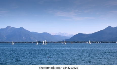 Yachts on Lake Chiemsee (Bavaria, Germany). View of the lake against the background of mountains.
