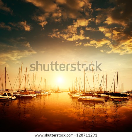 Yachts and pier at dusk