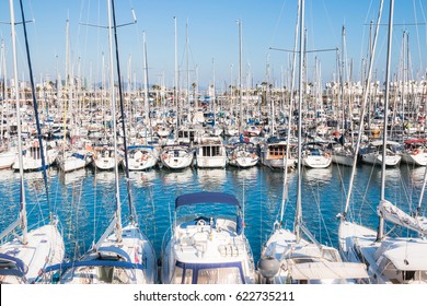 Yachts in the port. Sailboat harbor, many beautiful moored sail yachts in the sea port, modern water transport. Olympic port, Barcelona, Catalonia