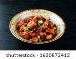 yakisoba noodles, traditional chinese dish spicy beef with sauce. Mongolian beef, pieces of beef stewed in soy sauce with spices in asian style