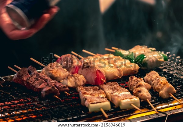 Yakitori Barbeque (BBQ) being grilled by\
street food store in Shinjuku, Tokyo,\
Japan.