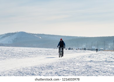 Yakutsk, Republic Of Sakha (Yakutia)/Russia-March 20 2016: Cyclist On Snow Track In Winter