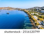 Yalikavak Bay of Bodrum. Mugla, Turkey. Panoramic view of Yalikavak marina and beach. Drone shot.