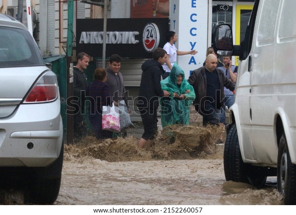 Yalta (Crimea, Crimean\
peninsula), 18.06.2021. Streams of water from overflowing banks as\
a result of heavy downpours of mountain rivers flow through the\
streets of Yalta.