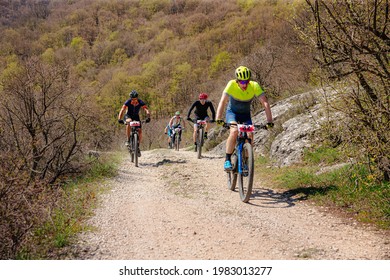 Yalta, Russia - May 1, 2021: Group Athletes Mountain Biker Riding Uphill During MTB Race