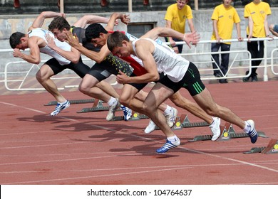 YALTA, UKRAINE - MAY 24: Unidentified athletes at the start of 100 meters dash on the international athletic meet between Ukraine, Turkey, Belarus on May 24, 2012 in Yalta, Ukraine .