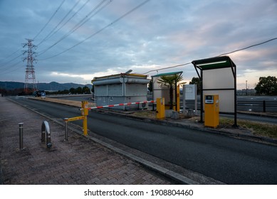 Yamadaike, Hirakata, Osaka, Japan - 3rd, Feb. 2021:The Parking Entrance Of Yamadaike South Park. It Open 24 Hours. This Time Is Later Of Sunset. Clouds Have Color Pink. 