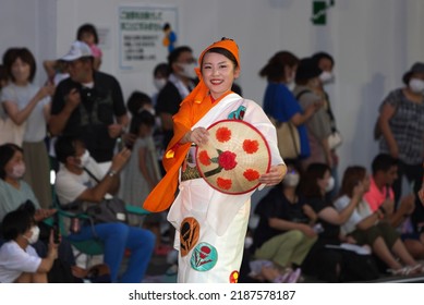 Yamagata City, Yamagata, Japan - August 7, 2022: A Hanagasa dancer holding a traditional hat during the Hanagasa Festival in Yamagata City. 