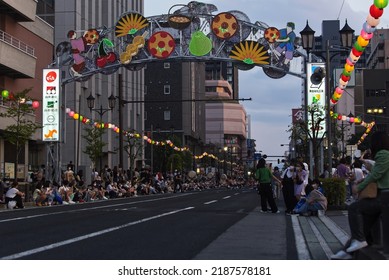 Yamagata City, Yamgata, Japan - August 7, 2022: People line the streets for the annual hana gasa parade in Yamagata City, Japan.