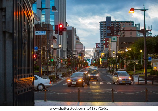 YAMAGATA, JAPAN -October 28,2018:Cars on Yamagata\
City Road, Night Trade District, and Night Lights.Cars on roads in\
Japan.