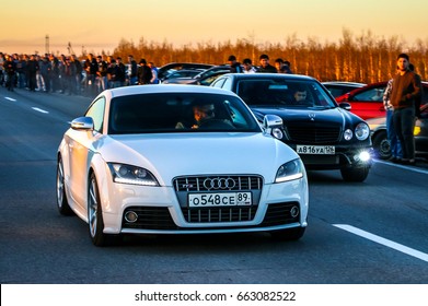 YAMAL, RUSSIA - JUNE 16, 2017: Motor Cars Audi TTS And Mercedes-Benz E55 AMG Take Part In The Night Street Drag Racing.