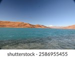 Yamdrok Lake, known as "Yamzho Yumco" in Tibetan, is one of the largest and most beautiful lakes in Tibet, located at an altitude of around 4,441 meters (14,570 feet) above sea level.