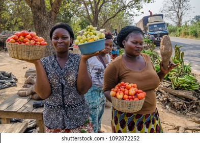 Yamoussoukro, Ivory Coast - January 31,2014: Unidentified African women presenting their vegetables at road market