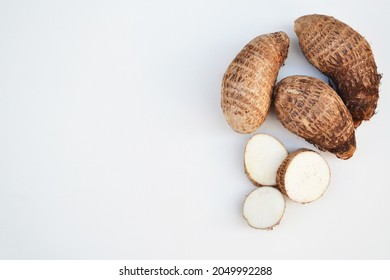 Yams on a white background. In Brazil this tubercle is known as "Inhame". Rich in vitamins and fiber, hormonal regulator, antioxidant and immune system strengthener. Healthy food concept.
