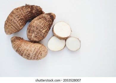 Yams on a white background. In Brazil this tubercle is known as Inhame. Rich in vitamins and fiber, hormonal regulator, antioxidant and immune system strengthener. Copy space.  Food medicine concept.