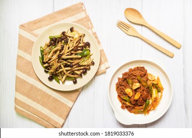 Yanagi Mutsutake (Japanese Mushroom) Stir-fried With Oyster Sauce With Korean Beef Stir Fry Is A Spicy Korean Beef That Is Mix With Gochujang Paste, Soy Sauce, Sesame Oil And Herbs On Table.