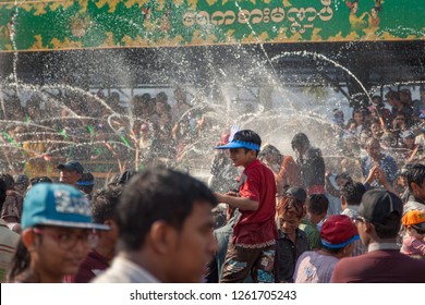 Yangon, Myanmar - April 14 2016 - Thingyan Water Festival: People out on the streets playing with water