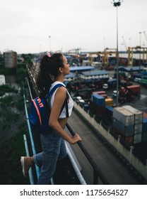 Yangon / Myanmar - August 24 2018: Burmese Model Exploring Rooftops And Container Yards.