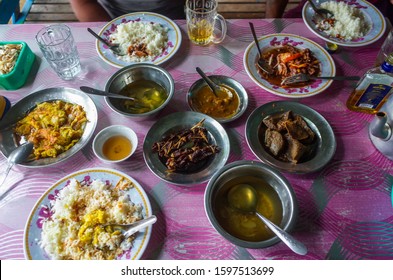 Yangon, Myanmar, Burma, September 17th 2019. Top View Of Traditional Burmese Food In A Local Small Restaurant. Heavy Meat, Vegetables, Drink, Rice, Egg, Chicken Soup. 