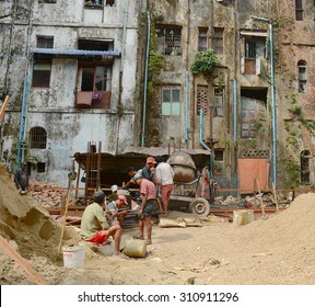 Yangon, Myanmar - Jan 14, 2015. Asian Workers Working At The Construction Site In Yangon City, Myanmar.