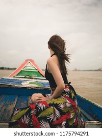 Yangon / Myanmar - September 1 2018: A Burmese Model Crossing A River On A Ship And Small Boat In Myanmar