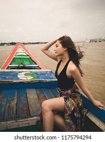 Yangon / Myanmar - September 1 2018: A Burmese Model Crossing A River On A Ship And Small Boat In Myanmar