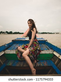 Yangon / Myanmar - September 1 2018: A Burmese Model Crossing A River On A Ship And Small Boat In Myanmar