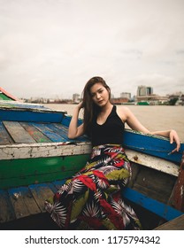 Yangon / Myanmar - September 1 2018: A Burmese Model Crossing A River On A Ship And Small Boat In Myanmar