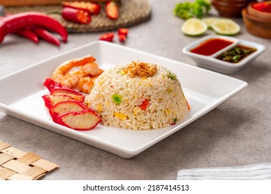 Yangzhou fried rice is a popular Chinese-style wok fried rice dish. Asia Chinese China food cuisine. Authentic Yangzhou fried rice with egg, fresh prawn and Red Roast Pork. - Shutterstock ID 2187414513