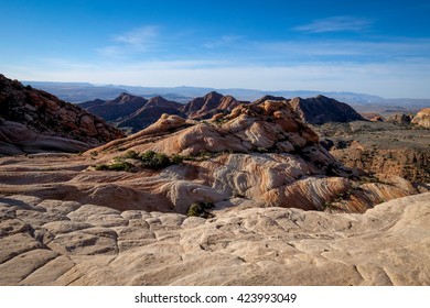 Yant Flat Cliffs - Red Cliffs National Conservation Area Near St. George, Utah - Colorful Wave Of Red Rock Formation With The Sum Skipping Off The Surface Early In The Morning