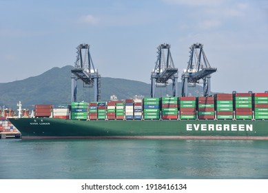 Yantian, Guangdong Province, China - October 12, 2020: panorama sea side view on sea port and International Container Terminal. Container ship owned by Evergreen company during cargo operations. 