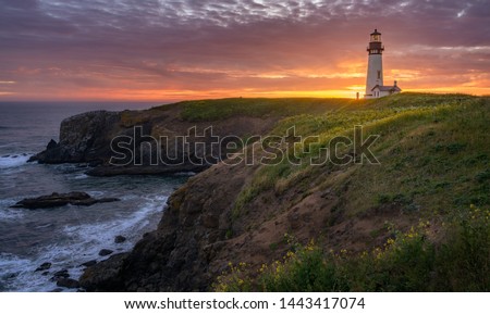 Yaquina Head Lighthouse with beautiful sunset