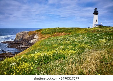 Yaquina Head Lighthouse on Grassy Cliff with Wildflowers and Ocean View - Powered by Shutterstock