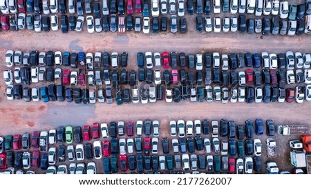 Yard of abandoned cars and seized for irregularity by the police. With many cars and many motorcycles parked. Aerial view