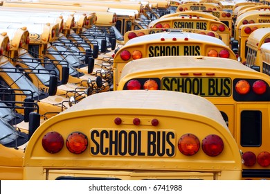 Yard Full Of Parked Yellow School Buses.