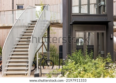 Yard of Modern Apartment Buildings with Outdoors Stairs and Outside Lift. Modern European Residential Yard.