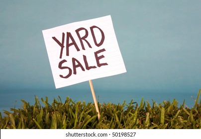 yard sale sign in grass